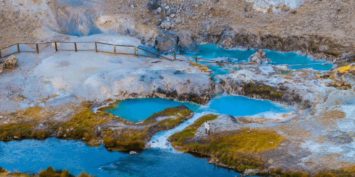 A birds eye view of hot springs with vivid blue water in Southern California