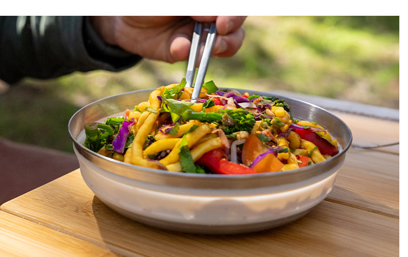 collapsible bowl and plate with fish bones on it Detour Stainless Steel Collapsible Bowl